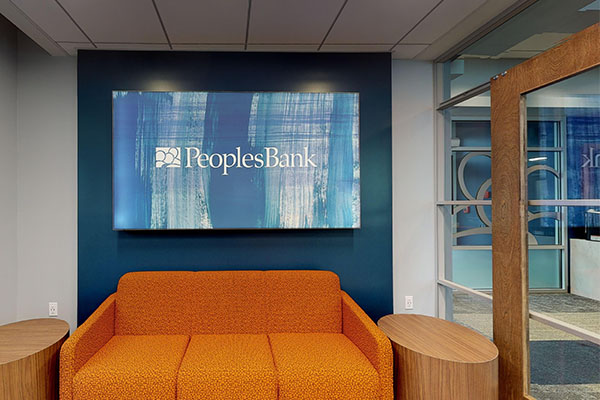 We installed several branding features in this bank that complemented the interior finishes. 