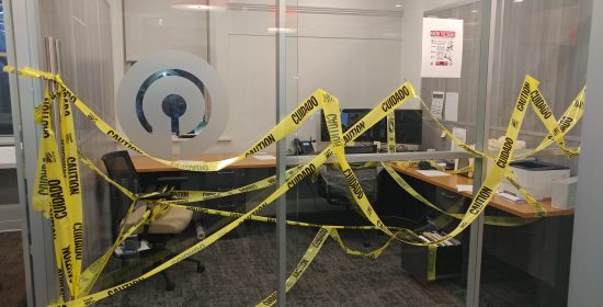 Dave's office is seen with copious amounts of yellow caution tape draped all around