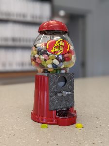 image of a Jelly Belly jelly bean dispenser filled with colorful jelly beans